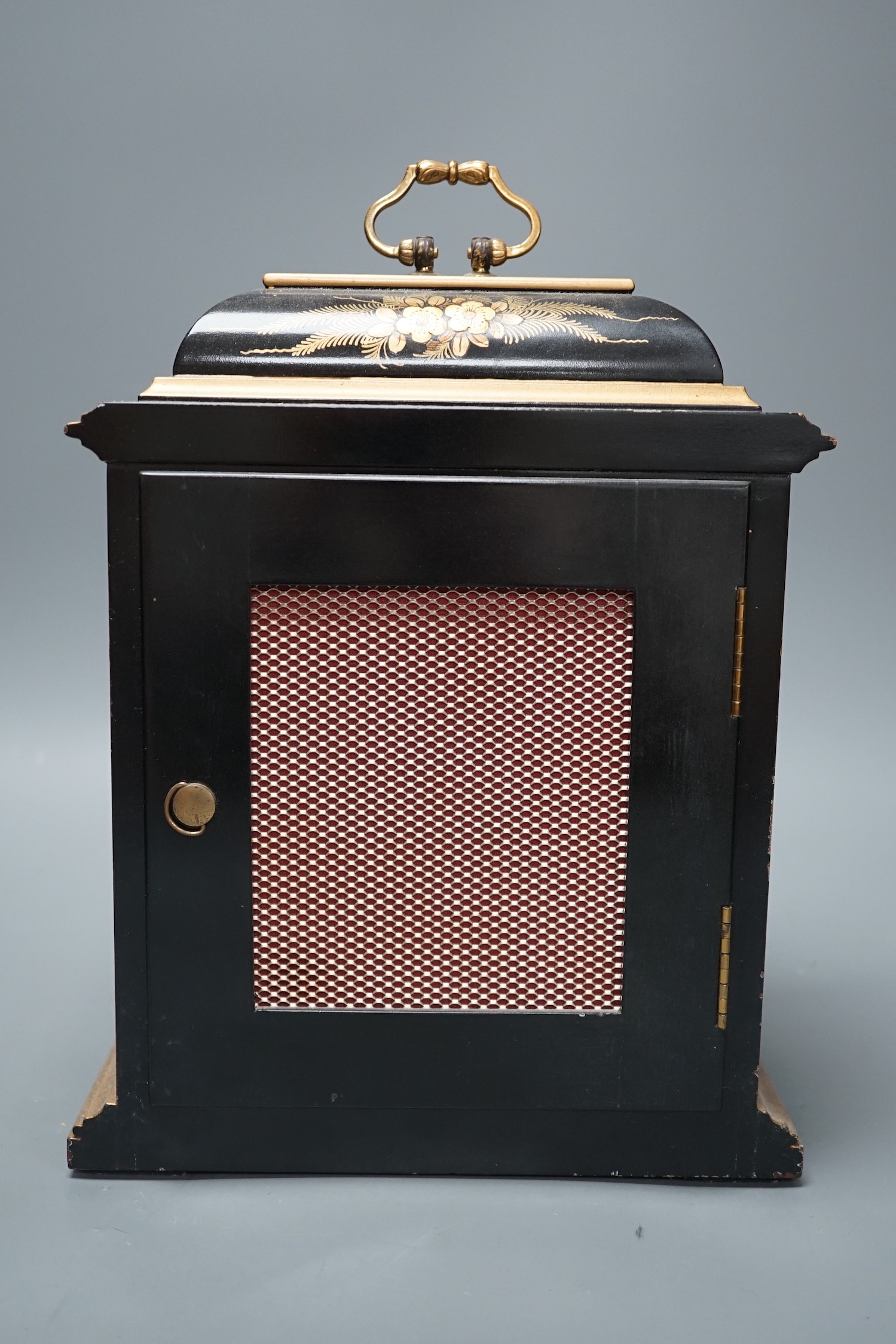 A F.W. Elliott japanned mantel clock, with chiming mechanism, 32 cms high